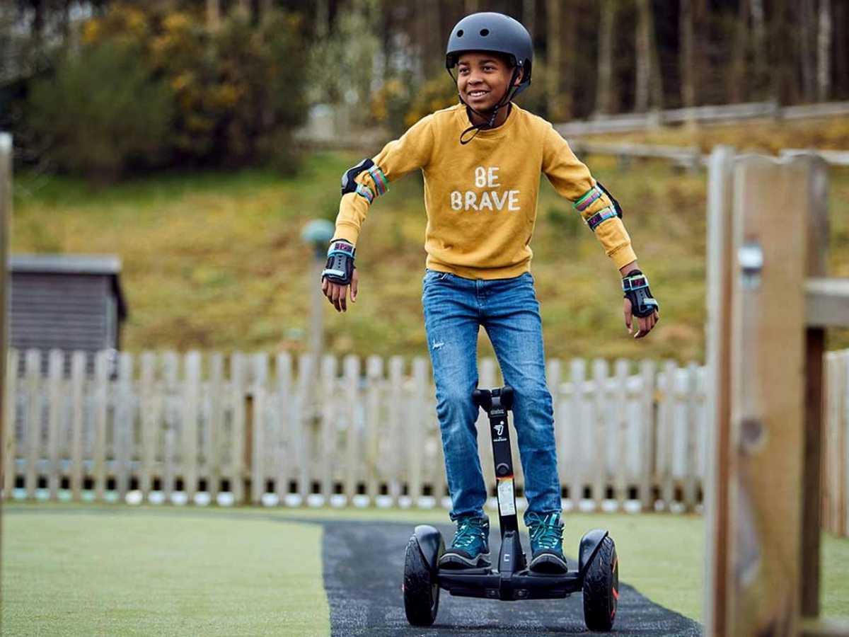 A child on a mini Segway