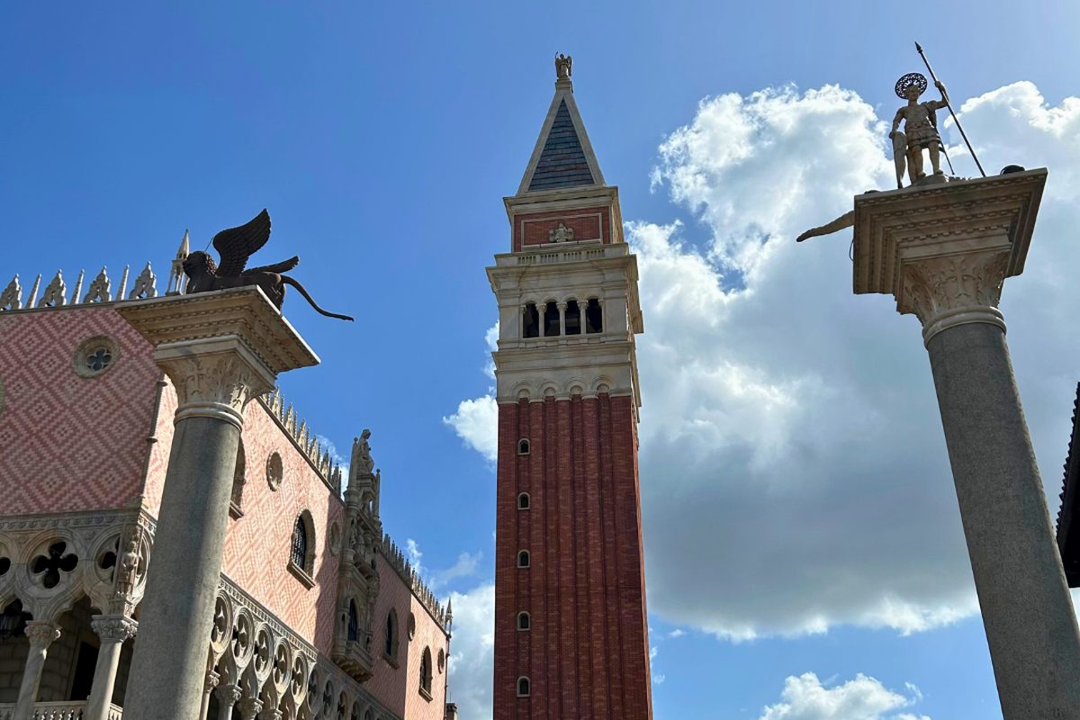 The Venetian bell tower and the pink patterned facade of the Doge's Palace at the Italy pavilion in World Showcase