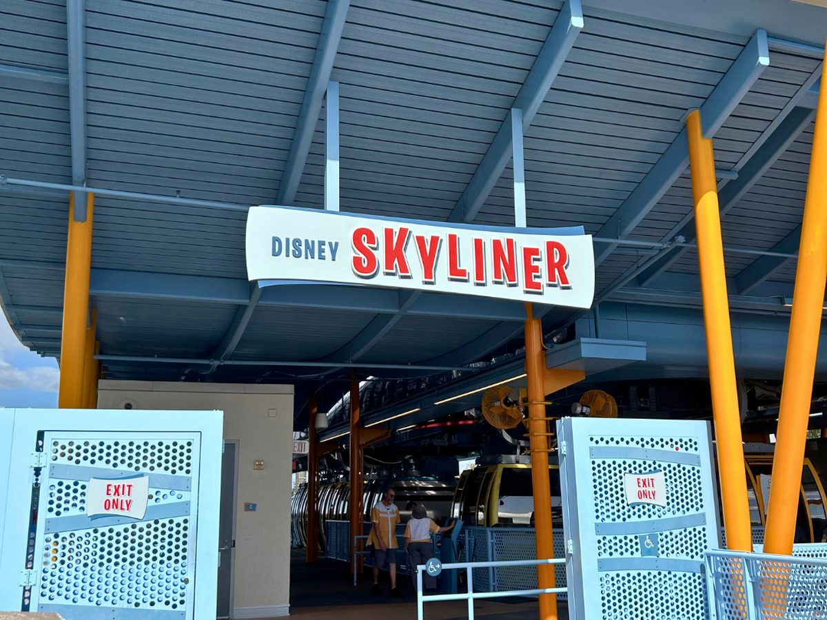 The Disney Skyliner sign over the station entrance shared by Pop Century and Art of Animation