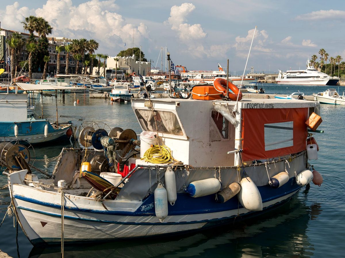 Fishing boats against a harbour quay