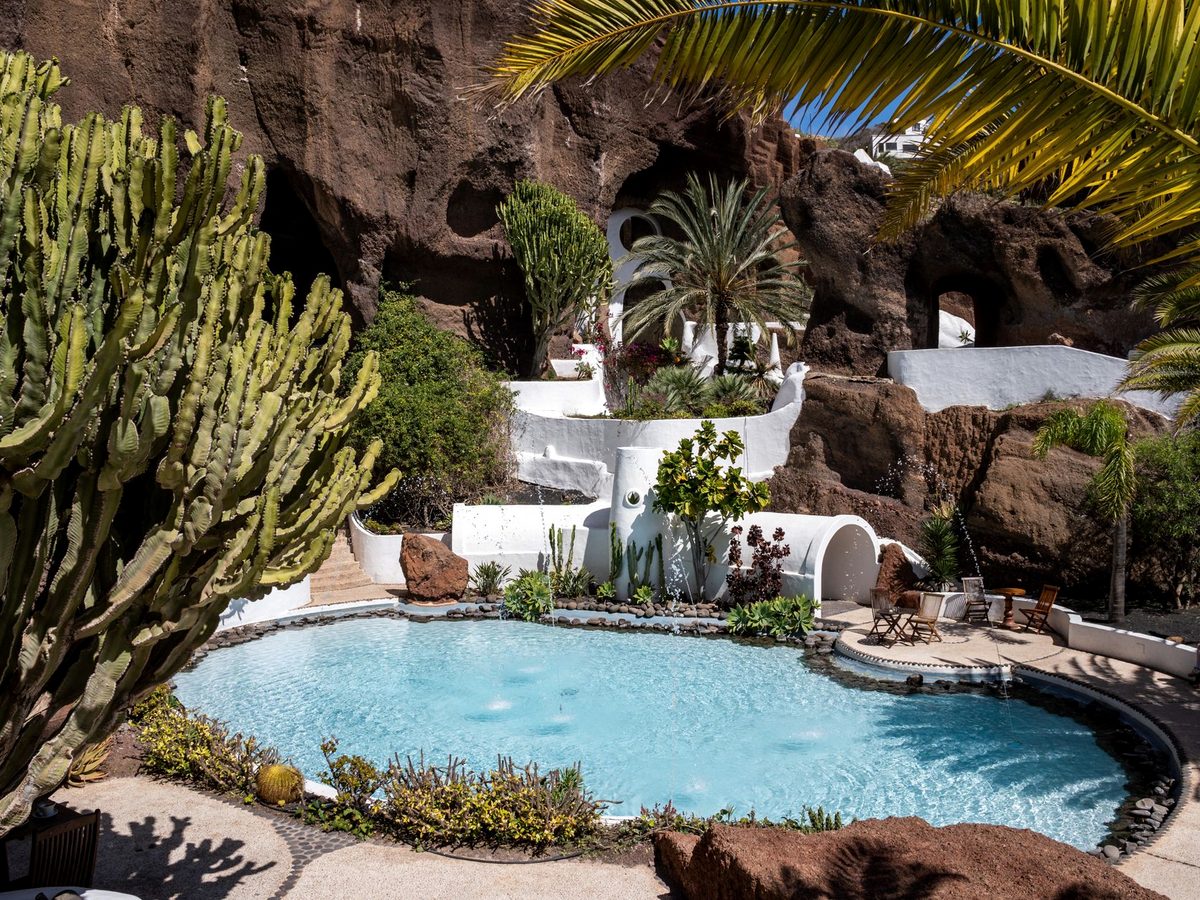 A pool built into the volcanic rock, painted white and turquoise