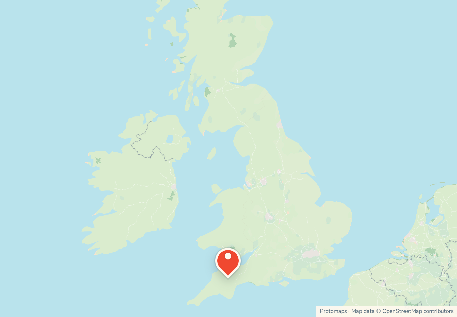 Map of the United Kingdom with Devon pinned in the south-west.