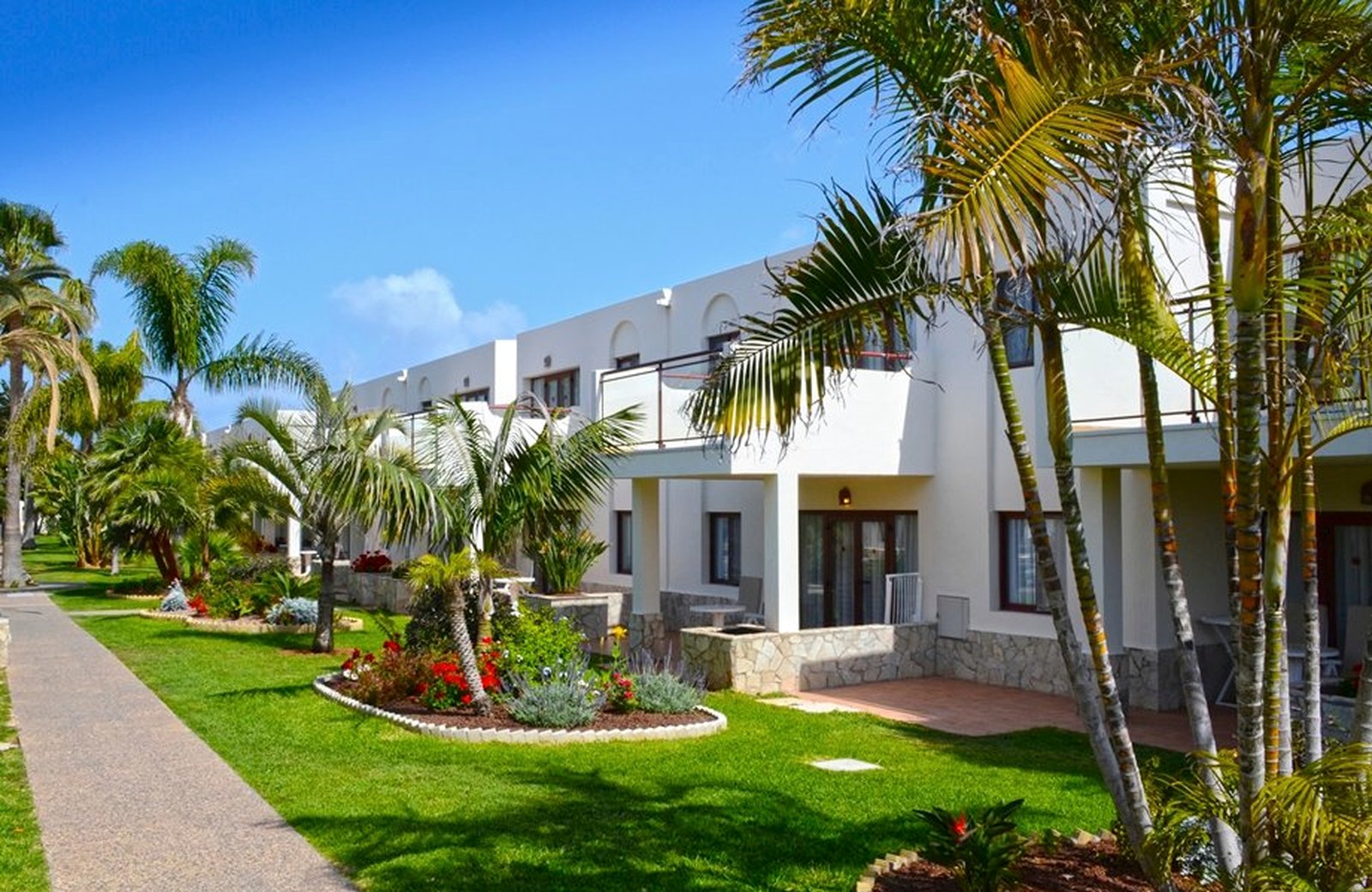 Alua Suites Fuerteventura: low-rise suite blocks and the pools among landscaped grounds on the edge of Corralejo.