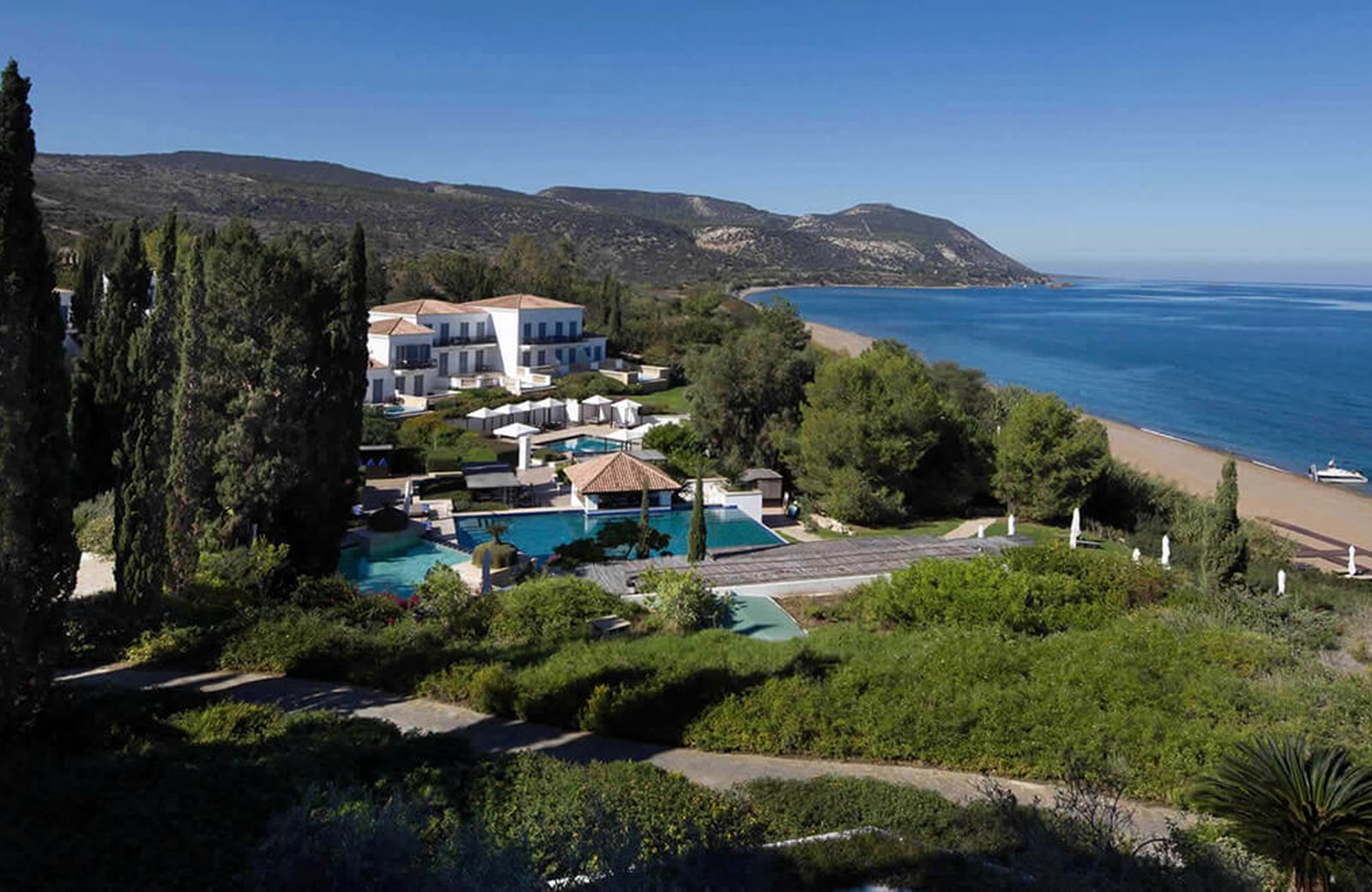 Anassa's whitewashed low-rise buildings stepping down a hillside through gardens to Chrysochou Bay in northwest Cyprus.