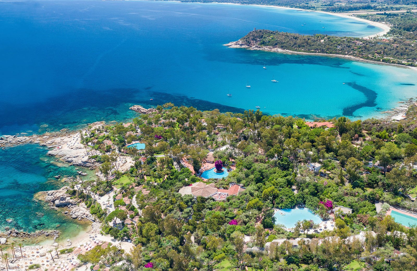 Arbatax Park Resort & Spa on the Capo Bellavista headland near Tortolì on the east coast of Sardinia, with its hotels set among the trees above the sea.