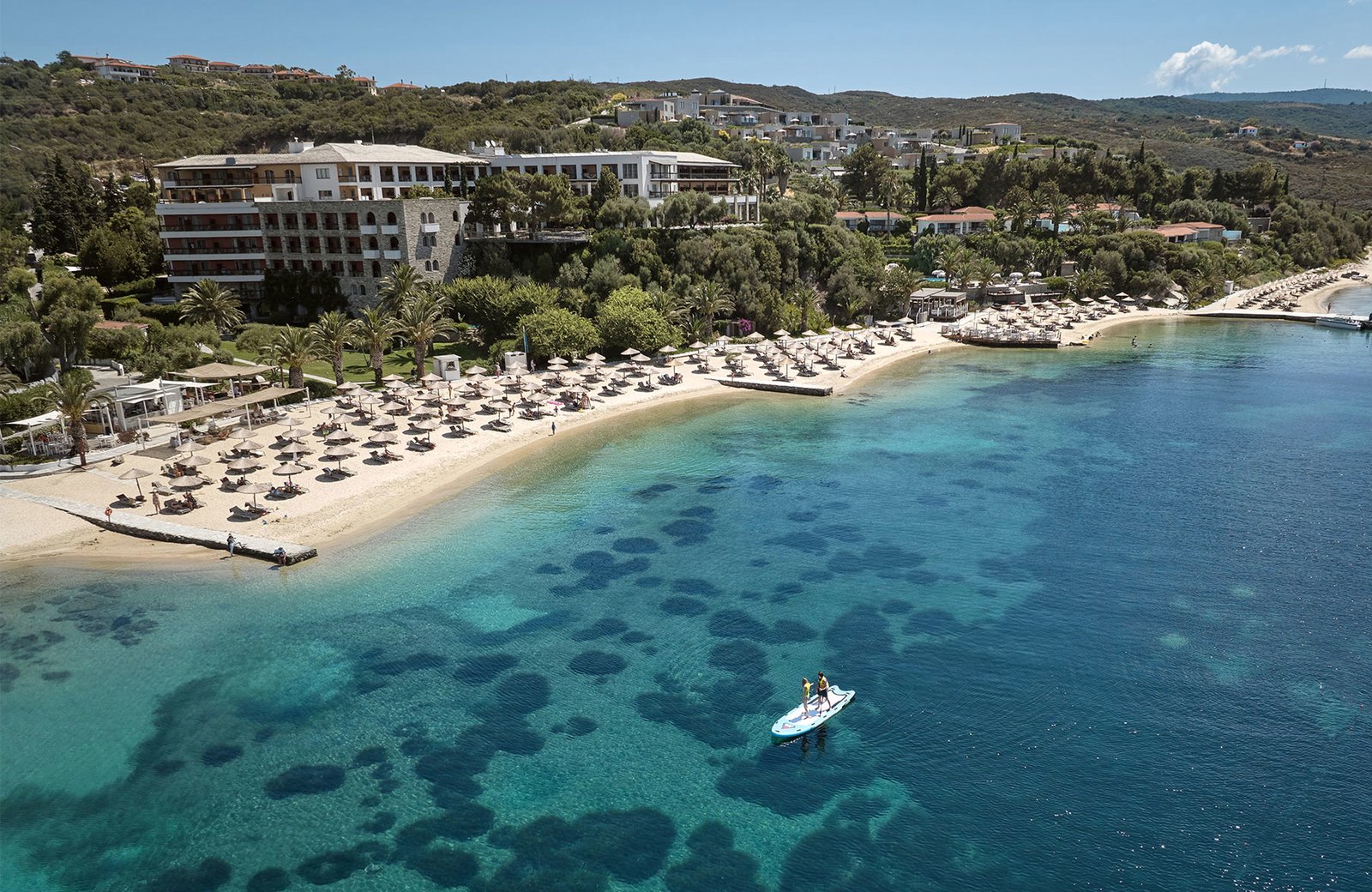 Eagles Palace among olive groves, pines and palms on its golden-sand beach at Ouranoupolis, on the Athos peninsula of Halkidiki.