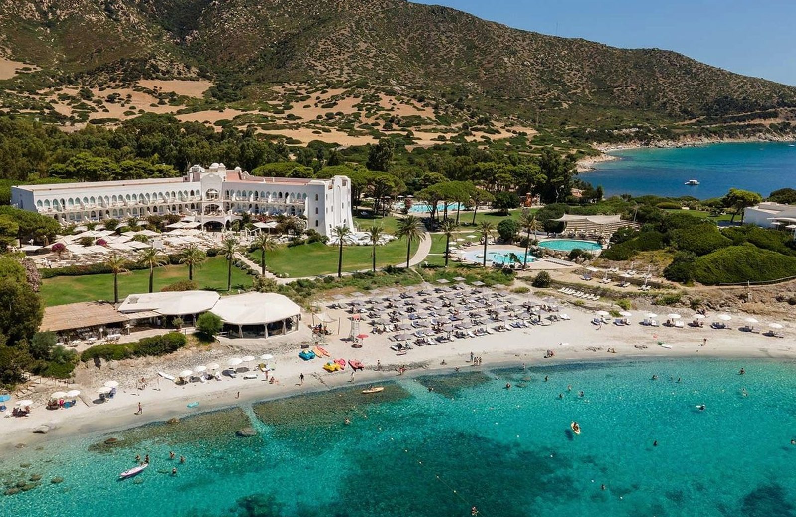The Moorish-styled main building and gardens of Falkensteiner Resort Capo Boi above its private white-sand bay near Villasimius in south-east Sardinia.