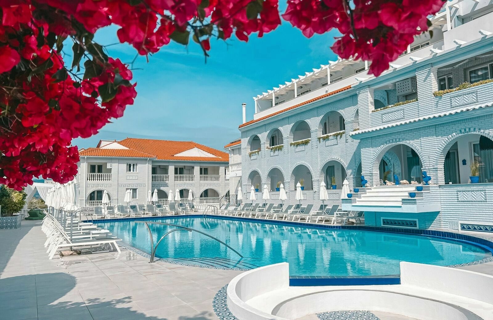 The Filoxenia Hotel in Tsilivi on Zante: low-rise buildings and pools in countryside set back from the beach.