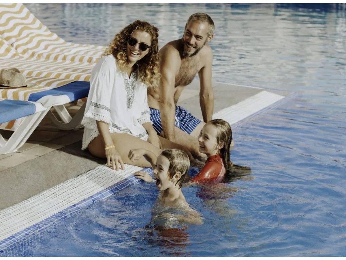 Loungers at the edge of the pool.