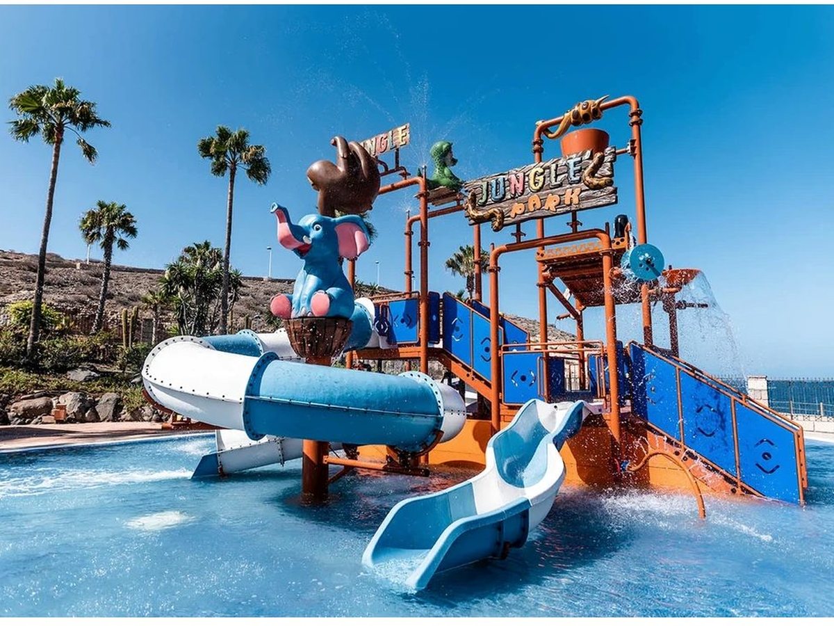 Jungle Park, a themed children's water park with slides and a jungle-styled play structure above a shallow pool.