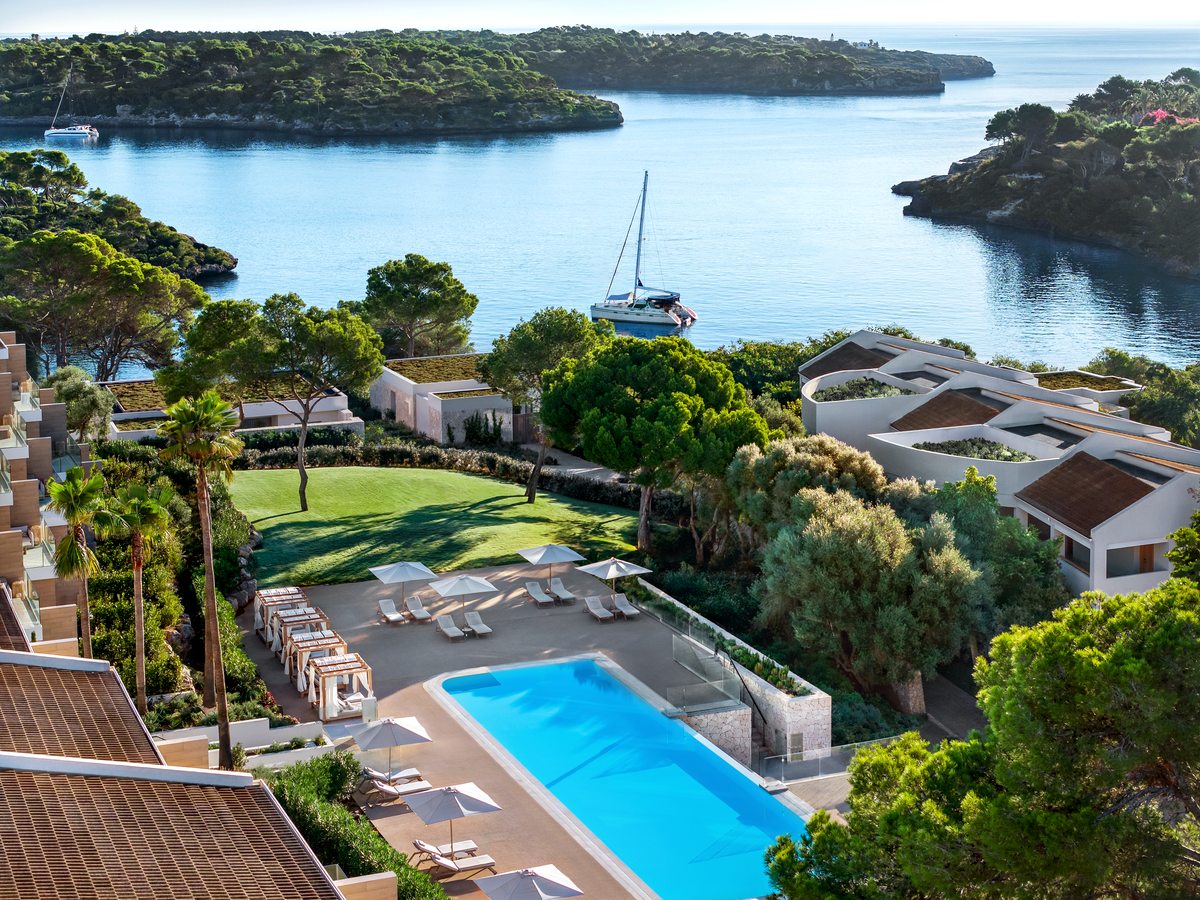 A pool above the cove at Ikos Porto Petro