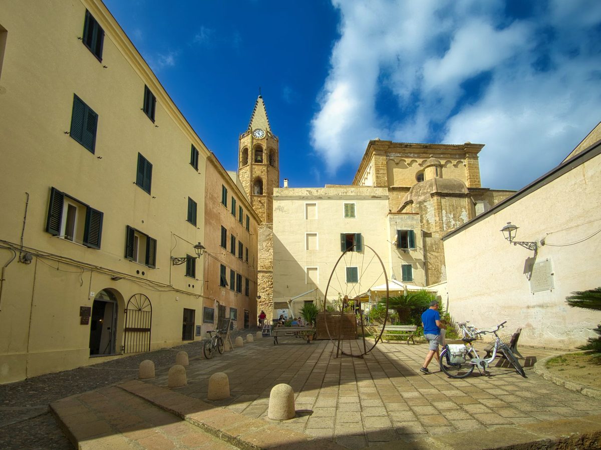 A sunlit square in Alghero's old town