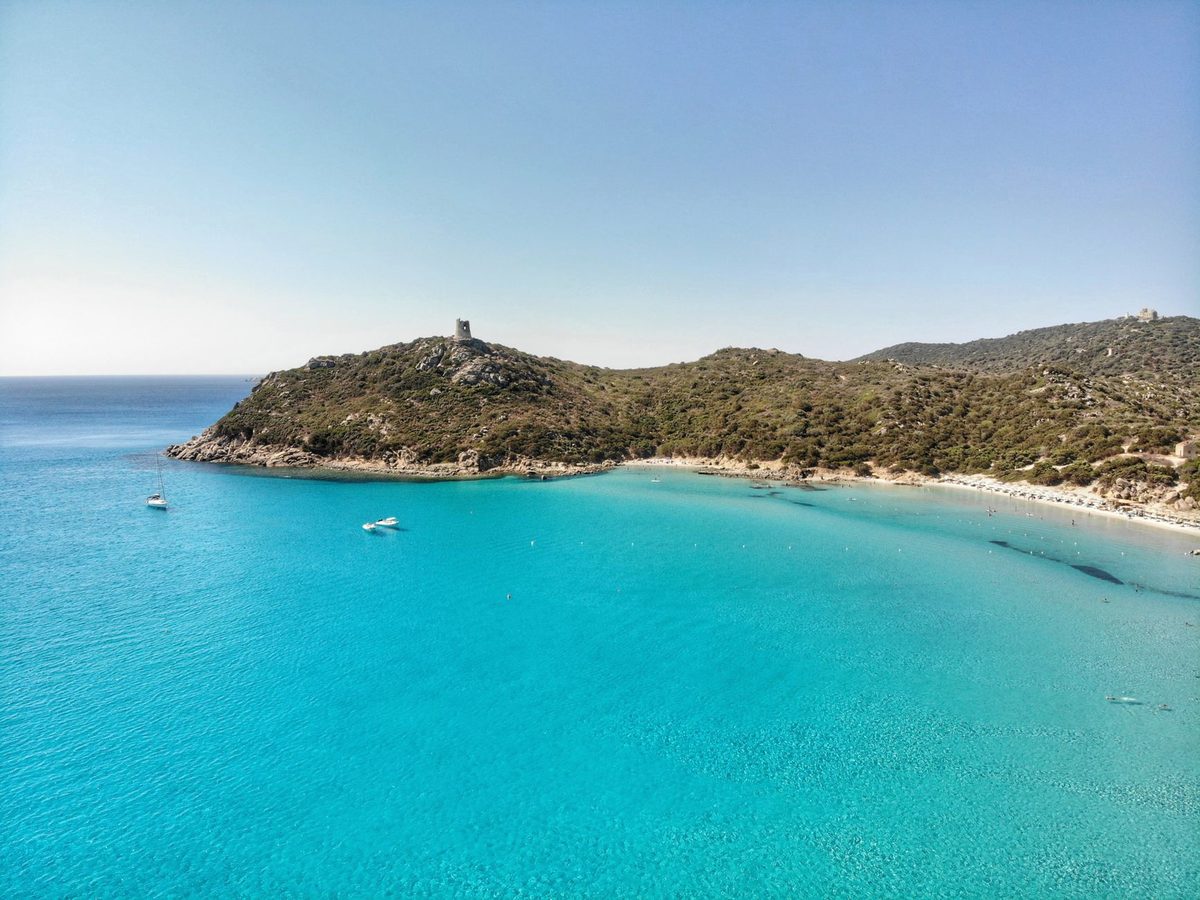 Porto Giunco beach and its headland tower at Villasimius from above